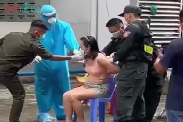 Cán bộ phường phá khóa căn hộ, cưỡng chế một phụ nữ đi xét nghiệm COVID-19