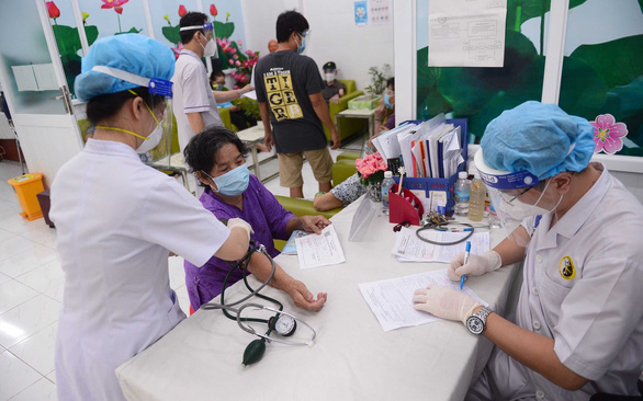 Tiêm vắc xin, sớm bước vào nước rút - Ảnh 3.